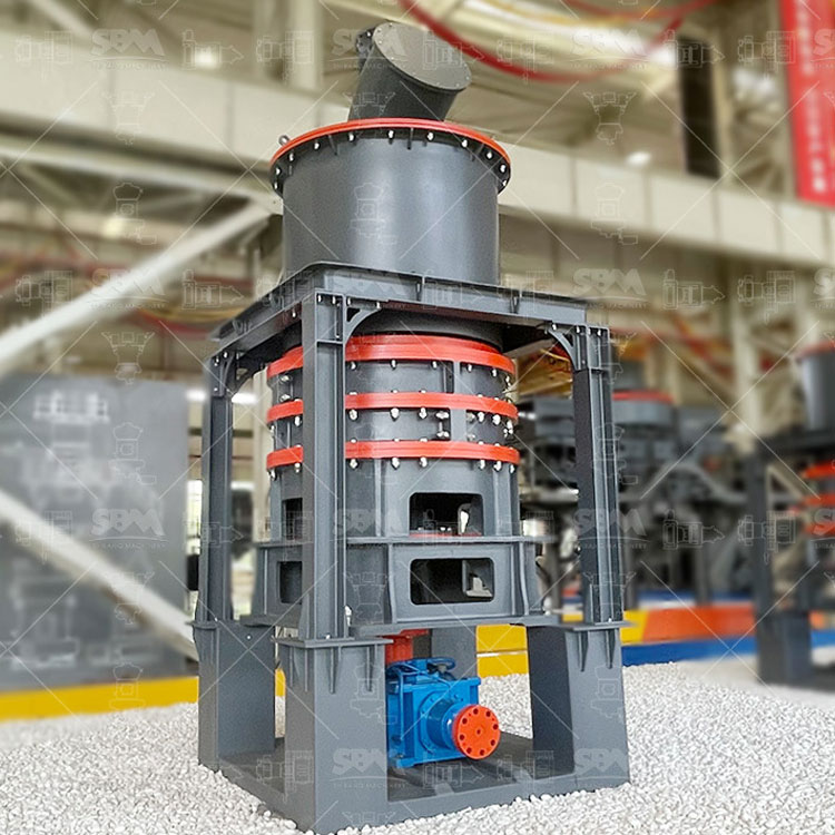 Operator monitoring the PLC touchscreen control panel of an SBM Medium-Speed Micro Powder Mill in an industrial plant.